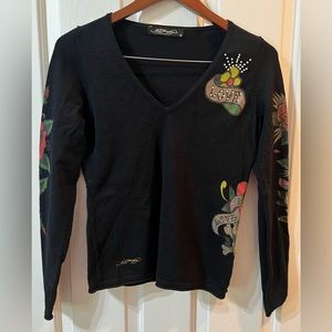 Ed Hardy long sleeve shirt. Size Large. Designs on sleeves and on back.